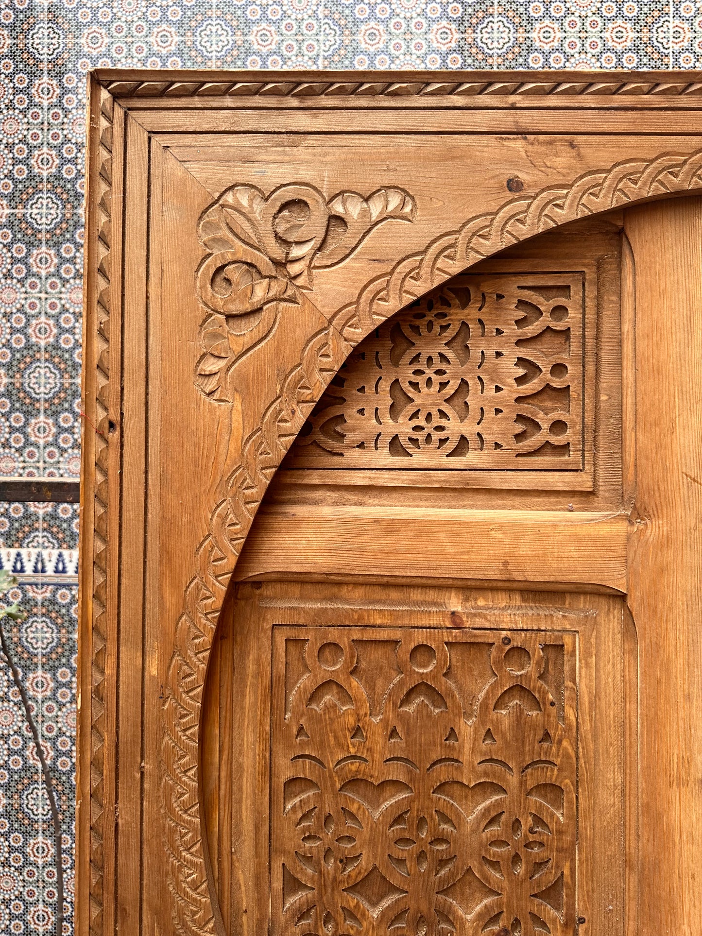 Hand-carved sliding wooden door, delicate oriental pattern, ideal for separating spaces while adding a touch of refinement.