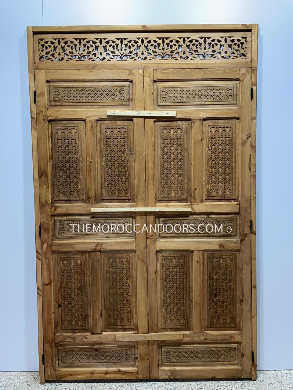 Traditional Moroccan door with precision-carved details