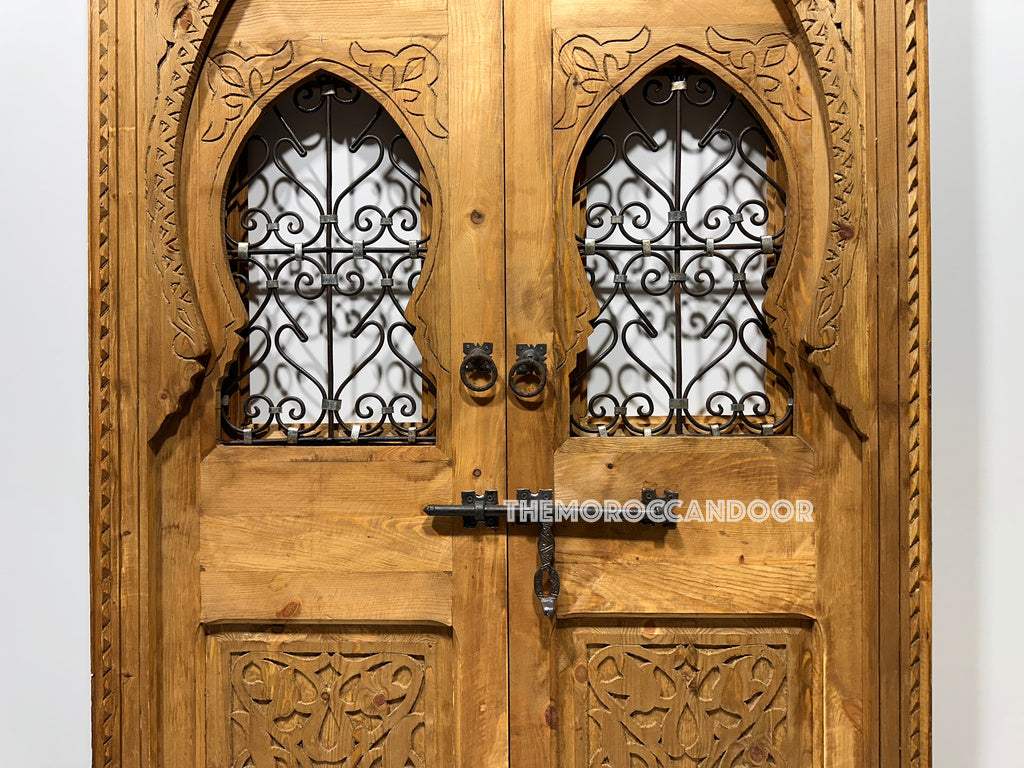 Person gazing through a hand-carved Moroccan door, creating a sense of mystery and intrigue. (Evokes a lifestyle image and creates intrigue for the product)