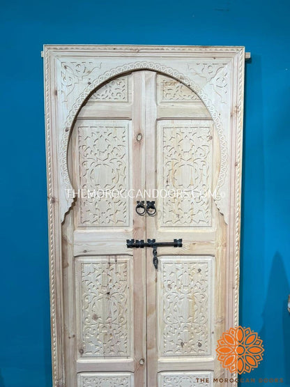 Elevate Your Curb Appeal: Hand-carved double wooden doors, a grand entrance that transforms your home's exterior into a captivating focal point