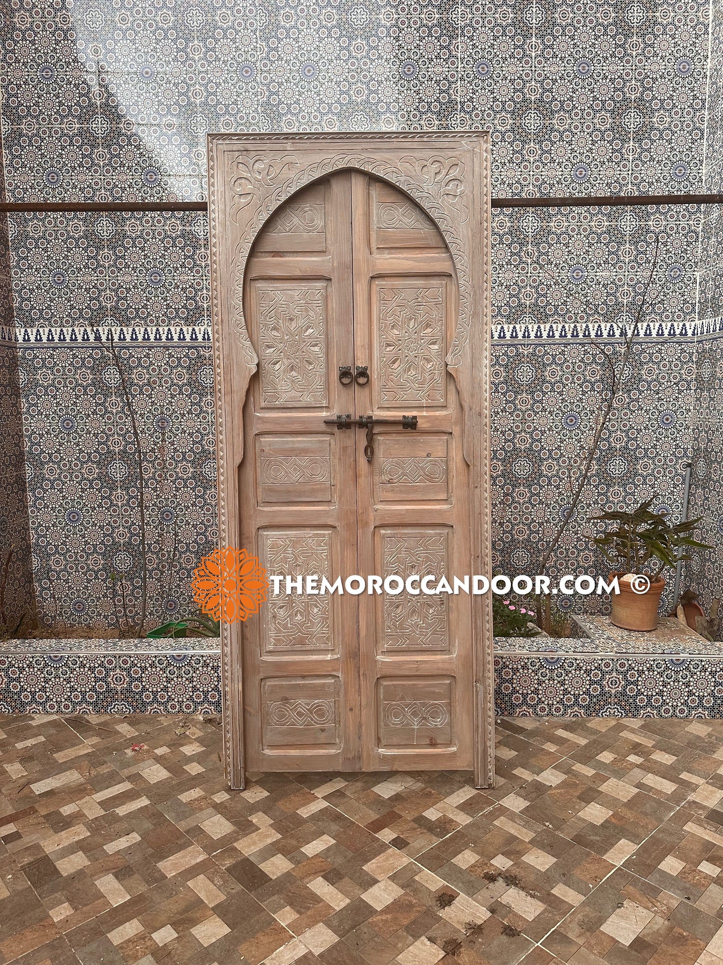 Elegance and Moroccan craftsmanship combine in this custom hand-carved door with white Color, bringing the magic of Morocco into your home.